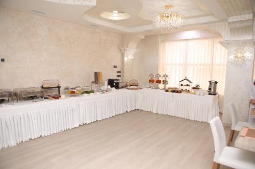 a white room with a counter and a window at Anga Yerevan Hotel in Yerevan
