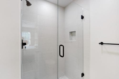 a shower with a glass door in a bathroom at Town of Rehoboth Beach 49 Delaware Ave in Rehoboth Beach