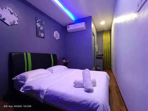 Ένα ή περισσότερα κρεβάτια σε δωμάτιο στο Cow B Homestay 城景