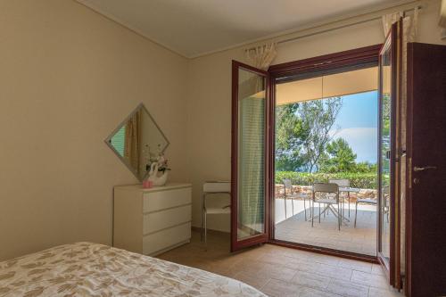 Ένα ή περισσότερα κρεβάτια σε δωμάτιο στο Secret Garden Residence