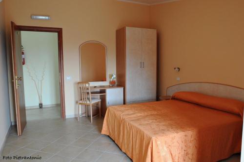 En eller flere senger på et rom på Hotel Vittoria