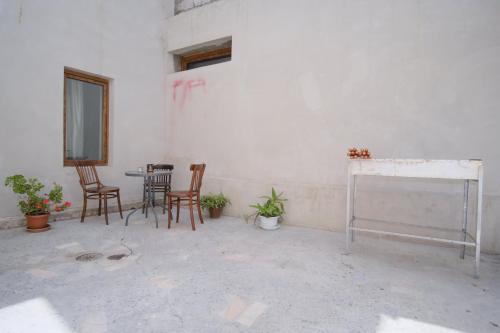 a room with chairs and a table and a window at Toon 55 Boutique Hotel in Gyumri