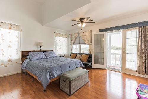 a bedroom with a bed and a ceiling fan at Atlantic City-Waterfront Park-Amazing 360 views in Atlantic City