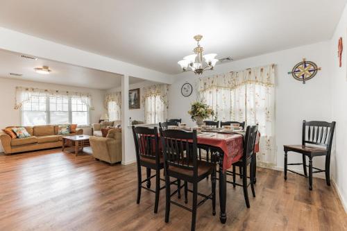 a dining room and living room with a table and chairs at Atlantic City-Waterfront Park-Amazing 360 views in Atlantic City