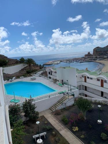 Bazén v ubytovaní Appartamento confortevole con piscina 7 alebo v jeho blízkosti