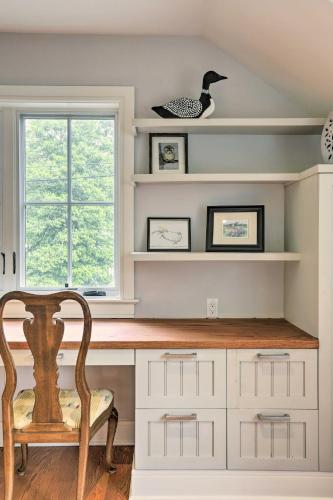 a home office with a desk and a chair at Barn-Like Studio Suite with Flowering Garden! in Titusville