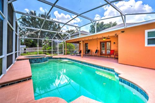 a swimming pool in the backyard of a house at Sunny Clermont Retreat with Lanai 12 Mi to Disney! in Orlando