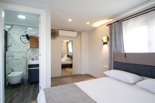 a bedroom with a large bed and a bathroom at Turna HOTEL in Istanbul