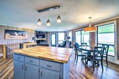 a kitchen and dining room with a table and chairs at Mtn Treehouse with Fire Pit, Breathtaking Views in Waynesville