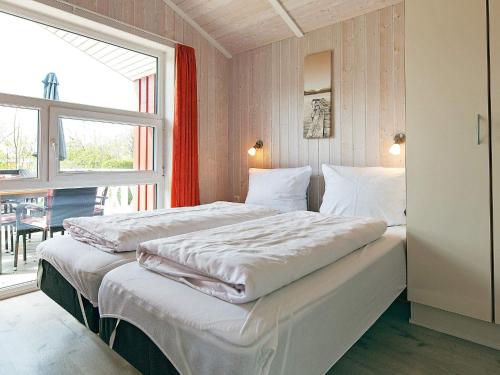 Postel nebo postele na pokoji v ubytování Three-Bedroom Holiday home in Grömitz 7
