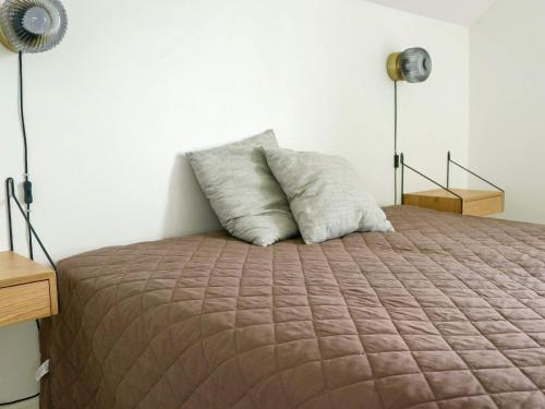 Een bed of bedden in een kamer bij Four-Bedroom Holiday home in Gjern 1
