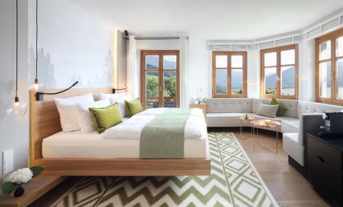a living room filled with furniture and a window at Das Tegernsee in Tegernsee