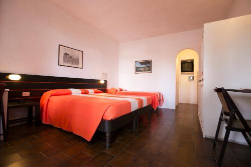 Katil atau katil-katil dalam bilik di Residence Cala Di Mola