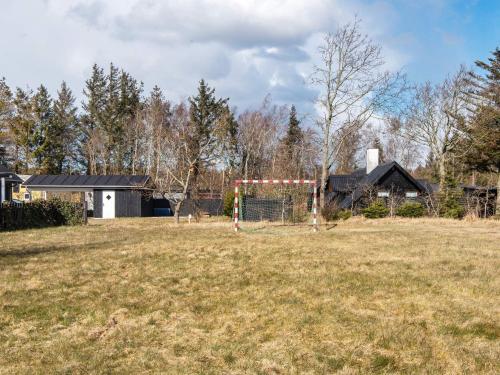 a field with a soccer goal in a yard at 6 person holiday home in Løgstør-By Traum in Løgsted