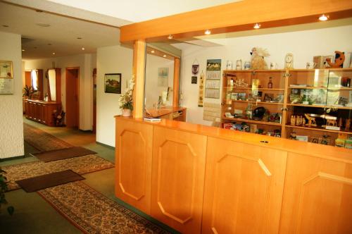 a large room with a counter in a store at Hotel & Restaurant Danelchristelgut in Lauter