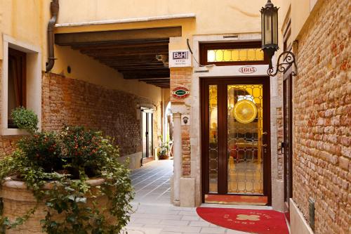 an entrance to a building with a glass door at Hotel Ca' D'Oro in Venice