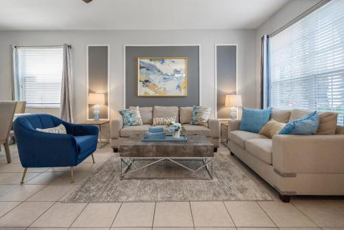 a living room with two couches and a coffee table at Spacious 6BR Villa Pool Parking Near Disney World in Orlando