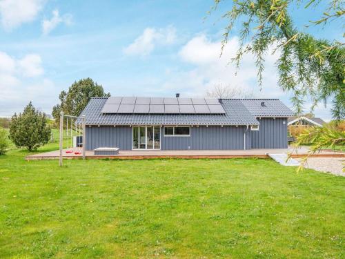 a house with solar panels on the roof at 8 person holiday home in Børkop-By Traum in Børkop