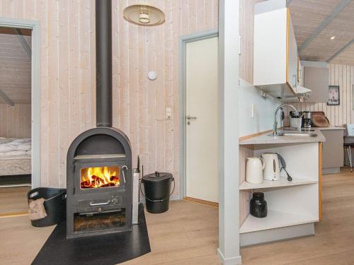 a kitchen with a stove in a room at 8 person holiday home in Børkop-By Traum in Børkop