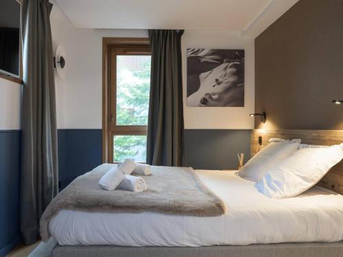 Postel nebo postele na pokoji v ubytování "Appartement 75m² Pieds des Pistes - Courchevel Village - 6/8 Pers, Proche Centre et Commerces" - FR-1-631-94