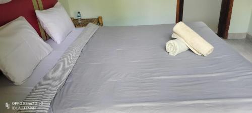 Ένα ή περισσότερα κρεβάτια σε δωμάτιο στο The Pondok