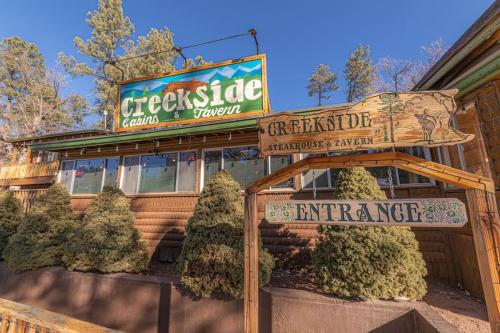 a restaurant with a sign that reads cecilsiearmaarma and a sign at Forest Cabin 3 Bear's Den in Payson