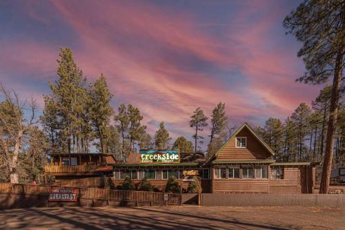 a log cabin with a sign on it at Hideaway forest cabin 9 Squirrels Den in Payson