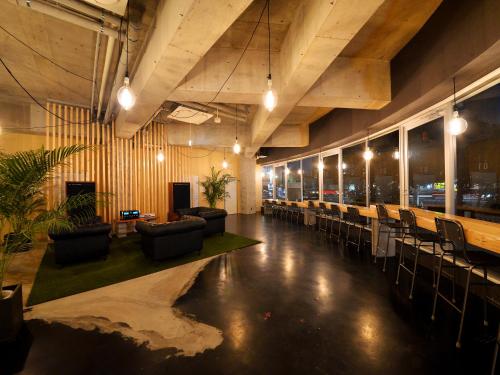 a large room with chairs and tables and lights at Hakodate Jyujiya Hotel in Hakodate