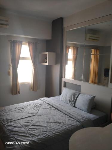 Ένα ή περισσότερα κρεβάτια σε δωμάτιο στο Apartemen margonda residence2