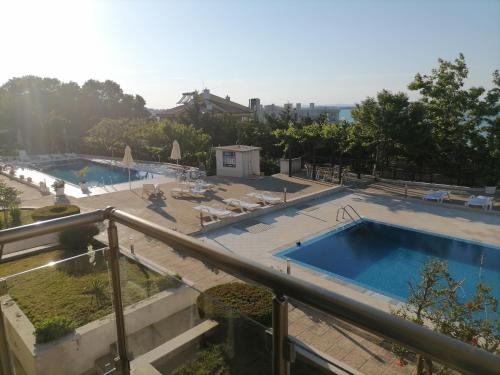 a view of a swimming pool from a balcony at Apolon 2 in Sozopol