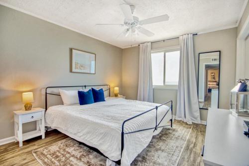 a bedroom with a bed and a ceiling fan at Windy Village C-6 in Myrtle Beach