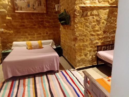 מיטה או מיטות בחדר ב-2 bedrooms apartement with city view furnished terrace and wifi at Tunis 4 km away from the beach