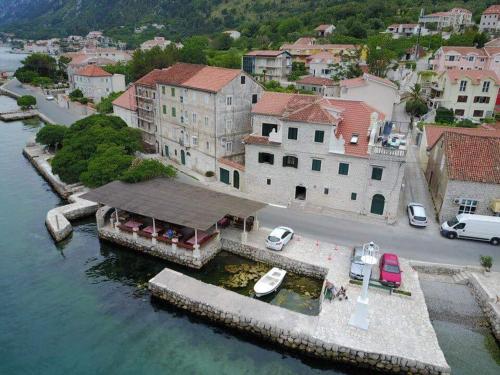 an aerial view of a house in the water at Apartments with sea view in Prcanj in Kotor
