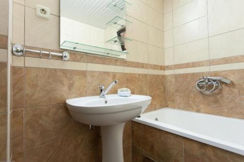 a bathroom with a sink and a bath tub at Apartments Tomic in Ohrid