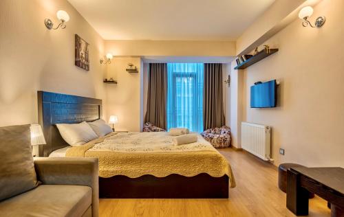 Postel nebo postele na pokoji v ubytování Studio Apartment NFT New Gudauri 215