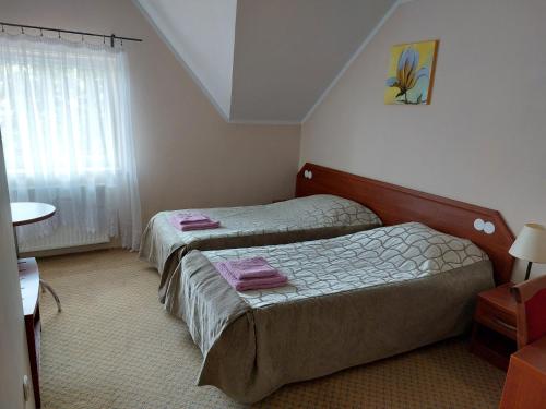 Katil atau katil-katil dalam bilik di Ośrodek ANKAR