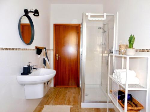 a bathroom with a toilet and a sink and a shower at Casa Azzurra in Marzocca di Senigallia