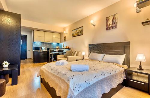 Postel nebo postele na pokoji v ubytování Studio Apartment NFT New Gudauri 215