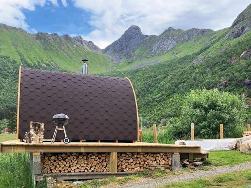 a building with a roof on top of a mountain at 5 person holiday home in LAUPSTAD in Vestpollen