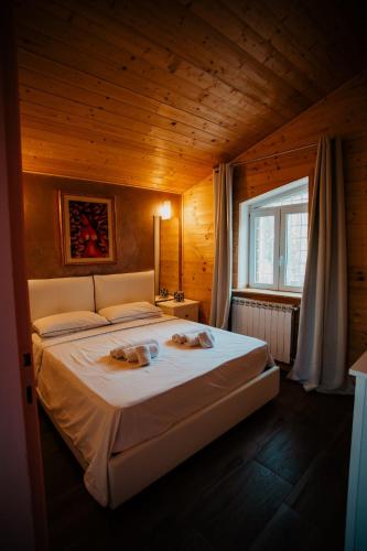 Una cama o camas en una habitación de Chalet B&B parcodellatimpa