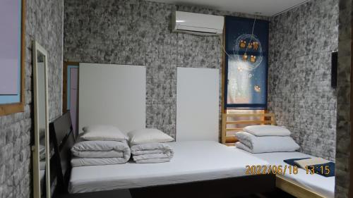 Cama o camas de una habitación en Sophiearth Apartment
