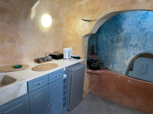 a kitchen with a sink and a counter top at Viletta Verte in Fira