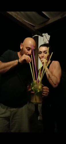 a man standing next to a woman with a bowl of food at Vento Del Sud in Chiaramonte Gulfi