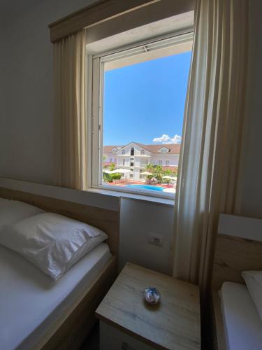 Ένα ή περισσότερα κρεβάτια σε δωμάτιο στο Hotel Andrea