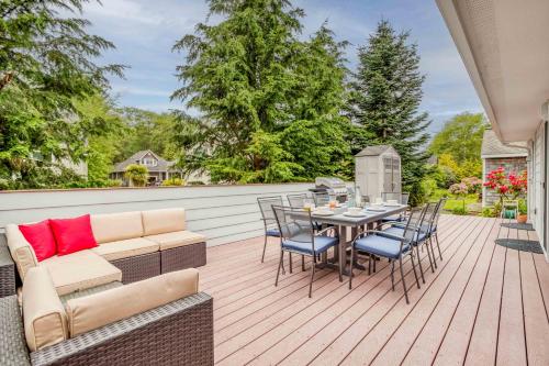 a patio with a couch and a table and chairs at Family Tides - Meredith Lodging in Neskowin