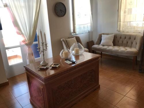 a living room with a table and a couch at Traditional House of Diafani in Karpathos Town