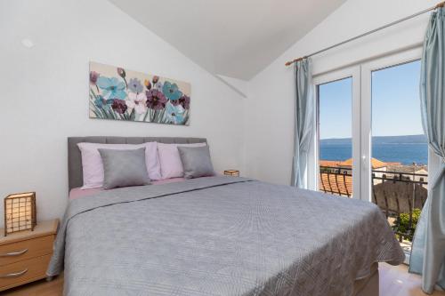 Ένα ή περισσότερα κρεβάτια σε δωμάτιο στο Apartments Paloc - Green