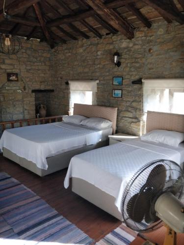 Postel nebo postele na pokoji v ubytování Agridia Taş apartlar