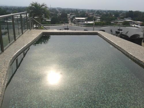 a swimming pool on the roof of a house at Hotel & Lounge Las Islas in San Juan Bautista Tuxtepec