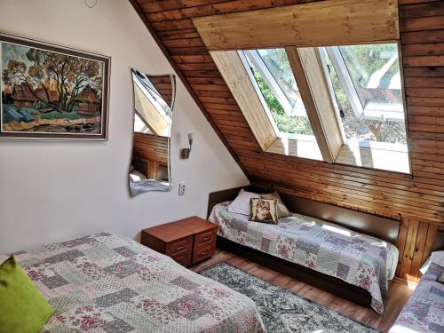 Posteľ alebo postele v izbe v ubytovaní Mini Kotedžas Vakaris